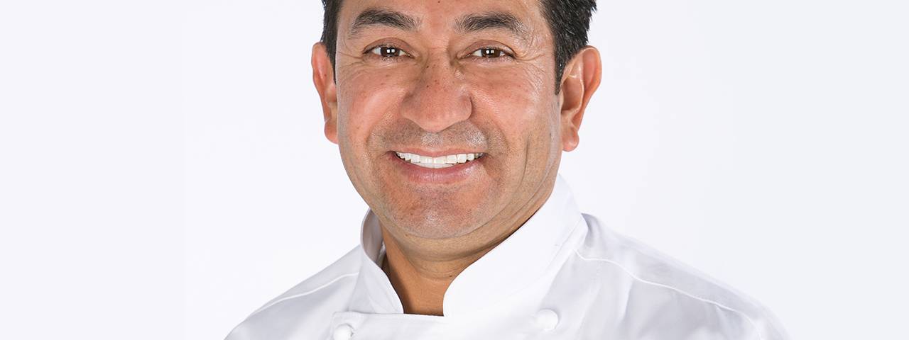 Executive chef Jose Luna smiles at the camera