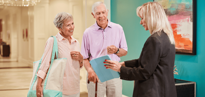 A couple speaks to a community team member.