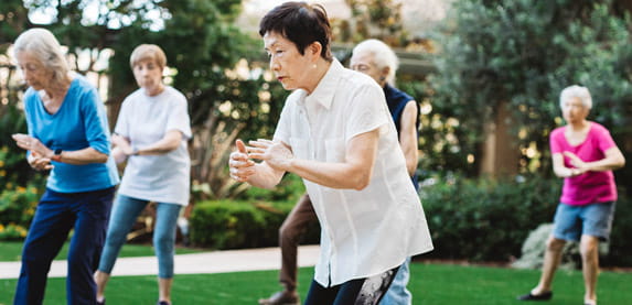 A Vi at La Jolla Village resident leads a tai chi class.