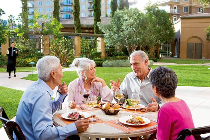 A group of people dining outside. 