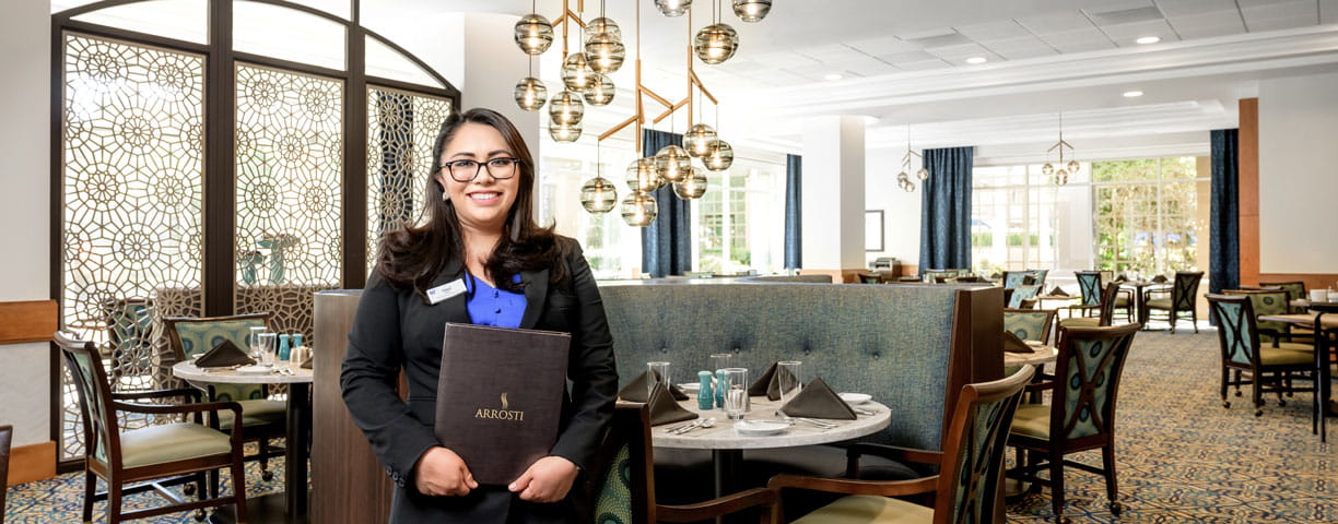 The hostess stands at Arrosti restaurant at Vi at La Jolla Village.