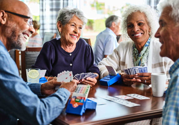 A group plays bridge at a Vi community.