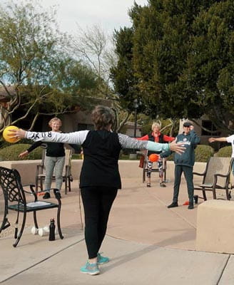 Laura Ensign leads an outdoor workout class