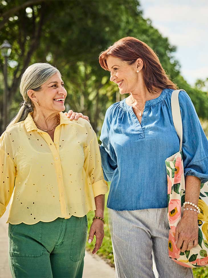 Two women walking outside.