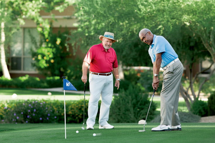 Two men golf at Vi at Silverstone.