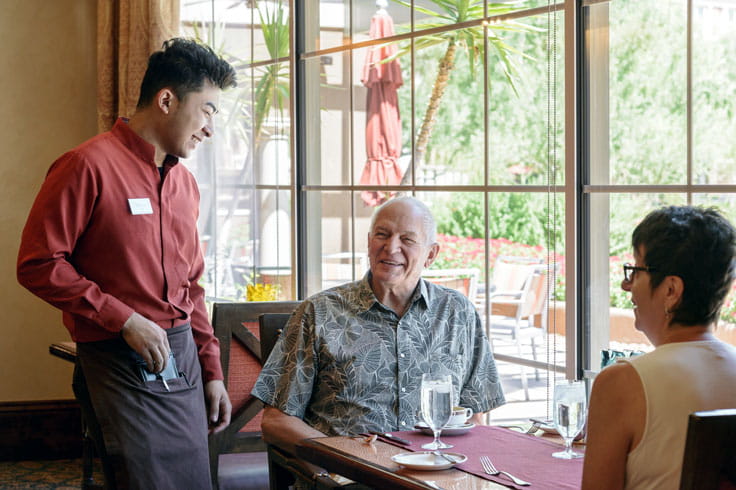 A server waits on diners