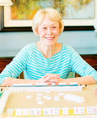 Resident Nancy Dolan playing Mahjong