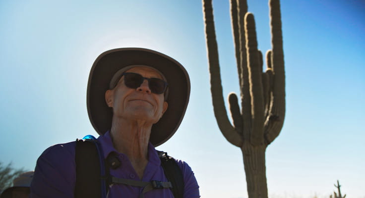 Vi at Silverstone resident Gary Dickey admires the saguaros. 