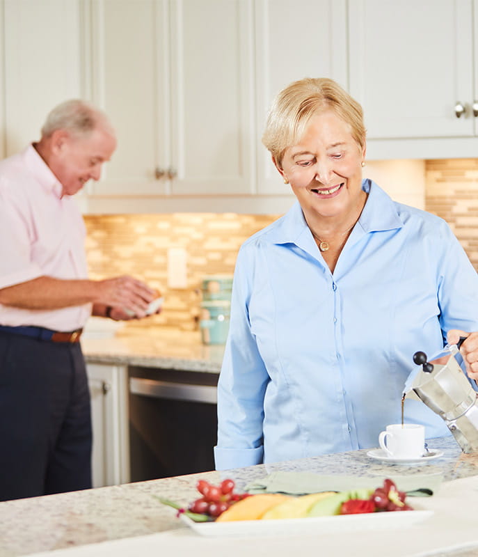 A couple cooking in home kitchen. 