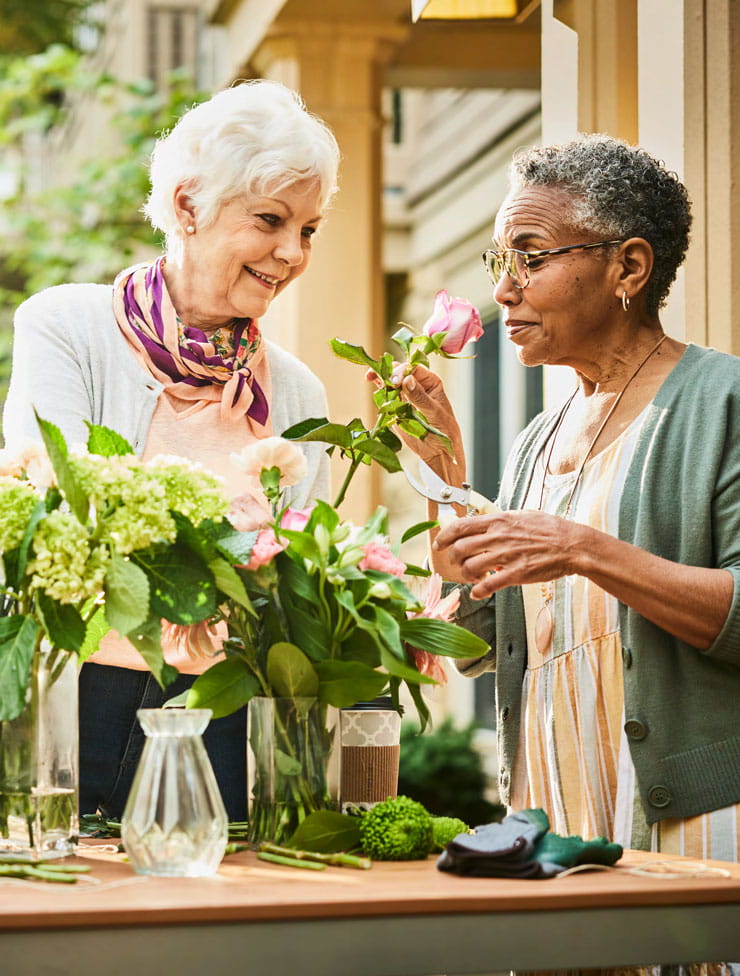 Women cut flowers.