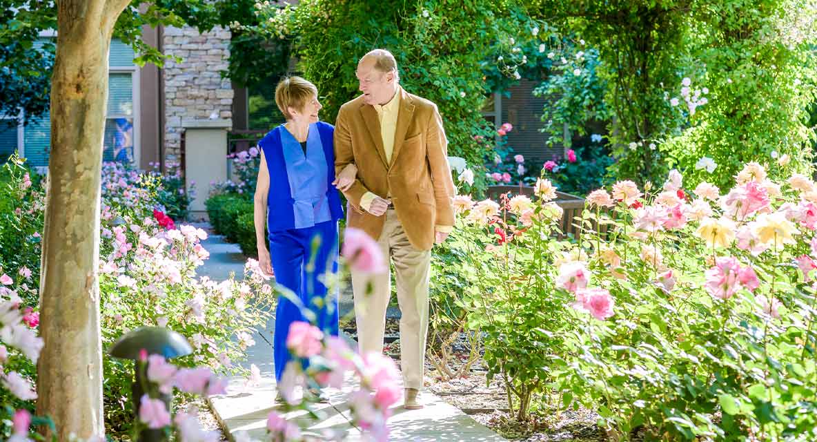 A couple walking outside. 