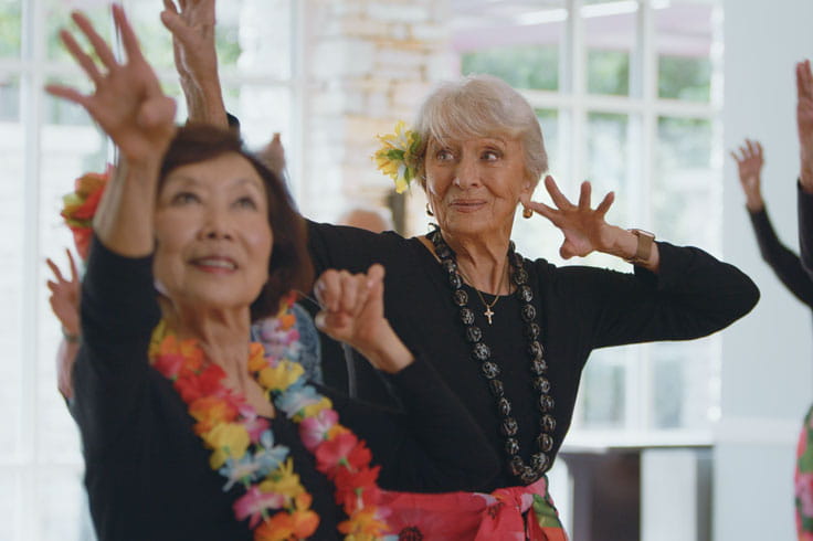 Residents practice hula.