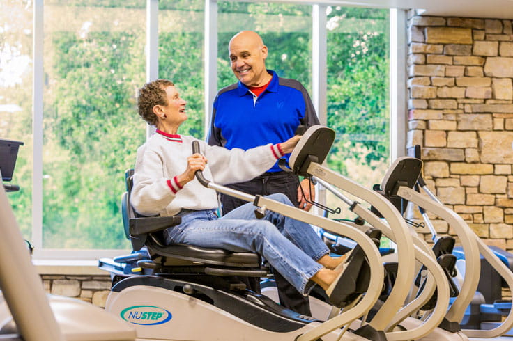 A resident exercises in the Vi at Palo Alto fitness center.