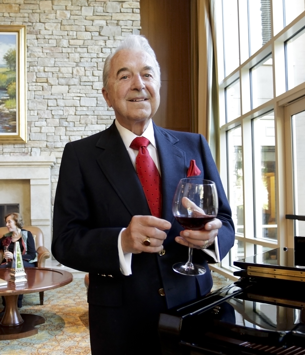 Man holding glass of wine. 