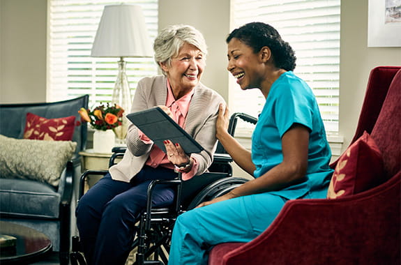 Woman and nurse talking.