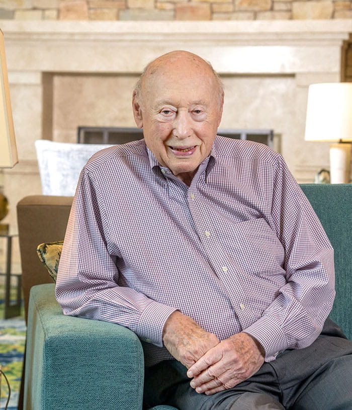 Man sitting and smiling.