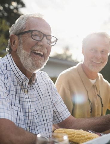 Men laughing outdoors