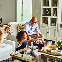 Man and girl playing chess. 