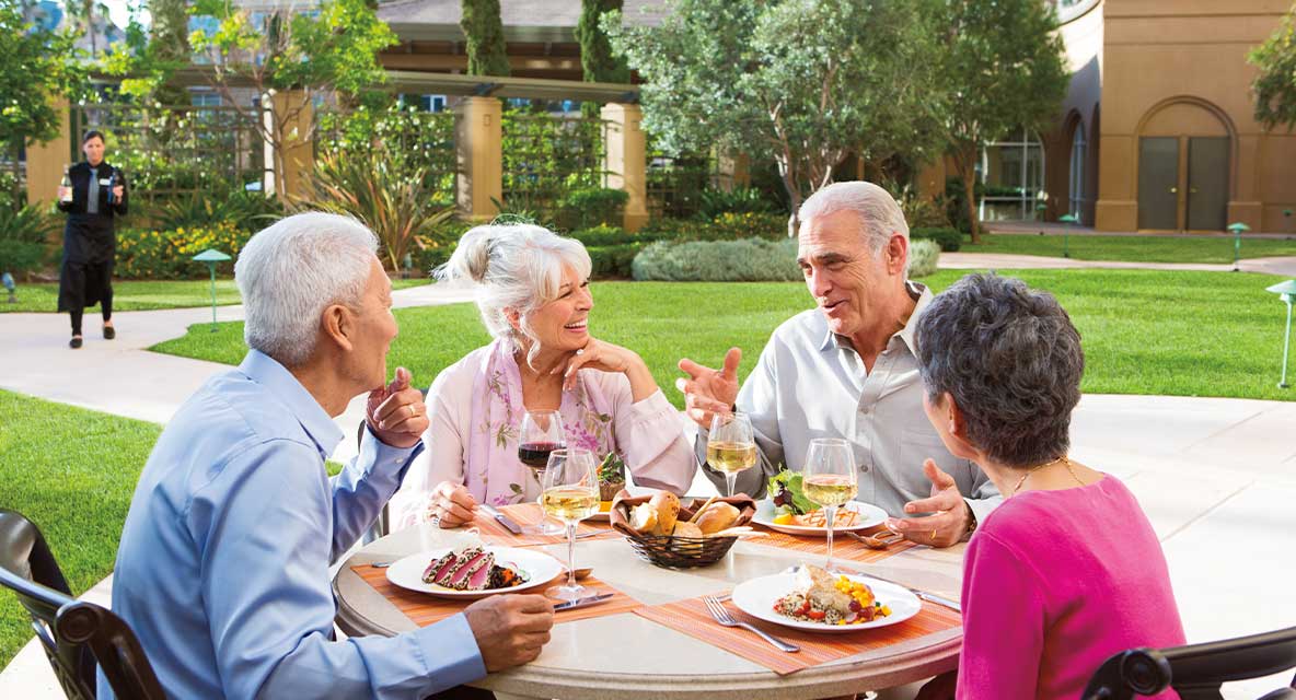 A group of seniors dining outside. 