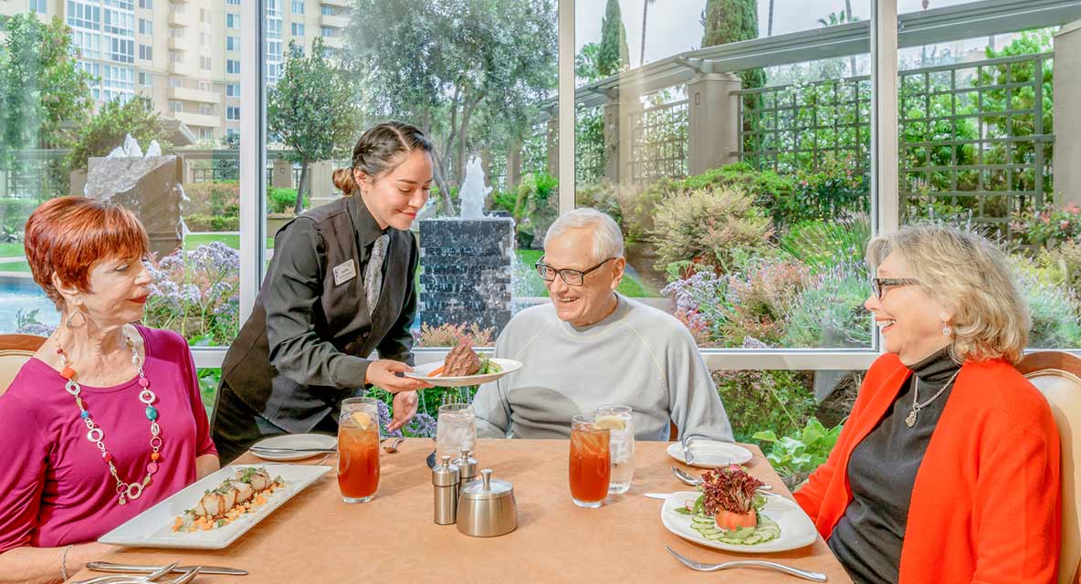 Indoor dining people being severed food. 