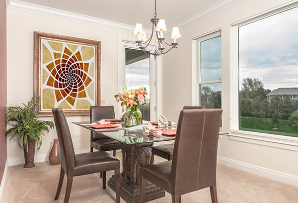 A dining room in a Vi at Highlands Ranch apartment.