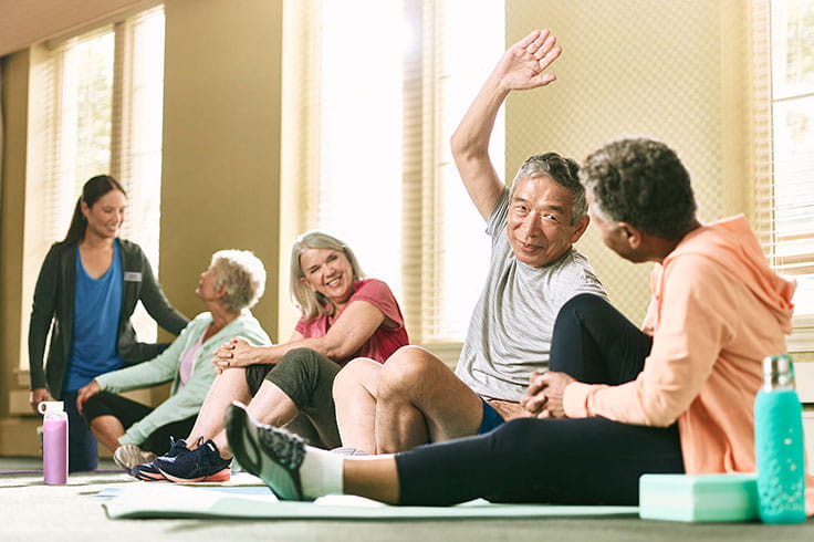 Residents stretch at the gym.
