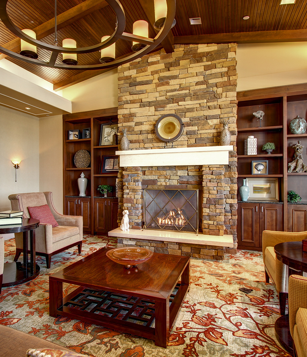 A fireplace in the Vi at Highlands Ranch lobby.