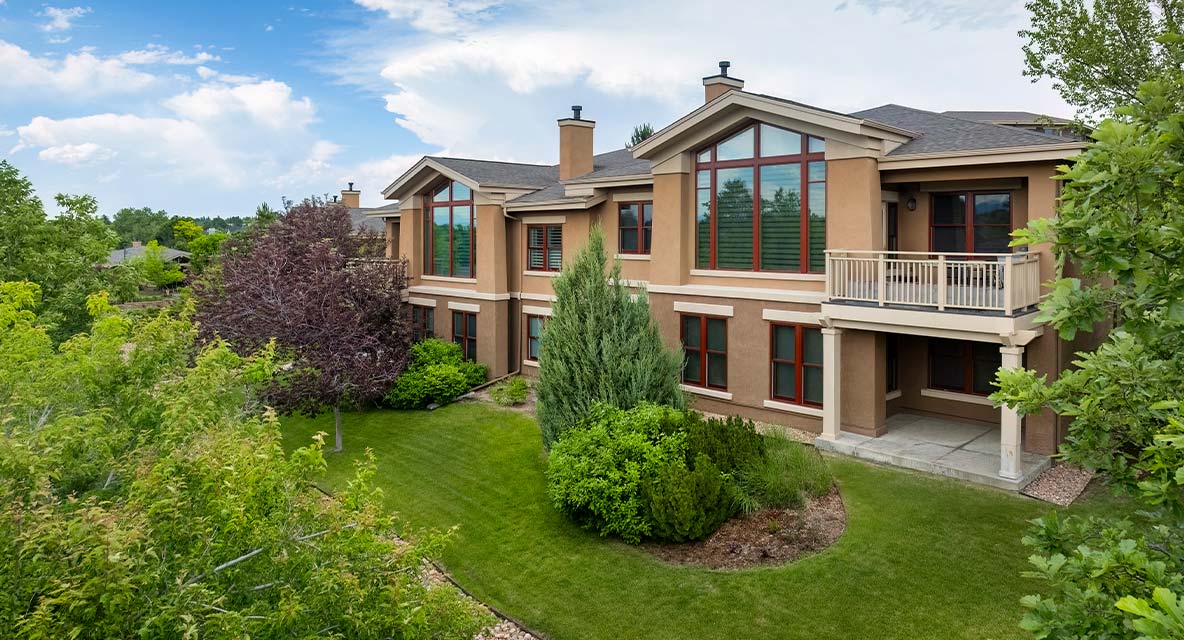 Vi at Highlands Ranch cottage exterior. 