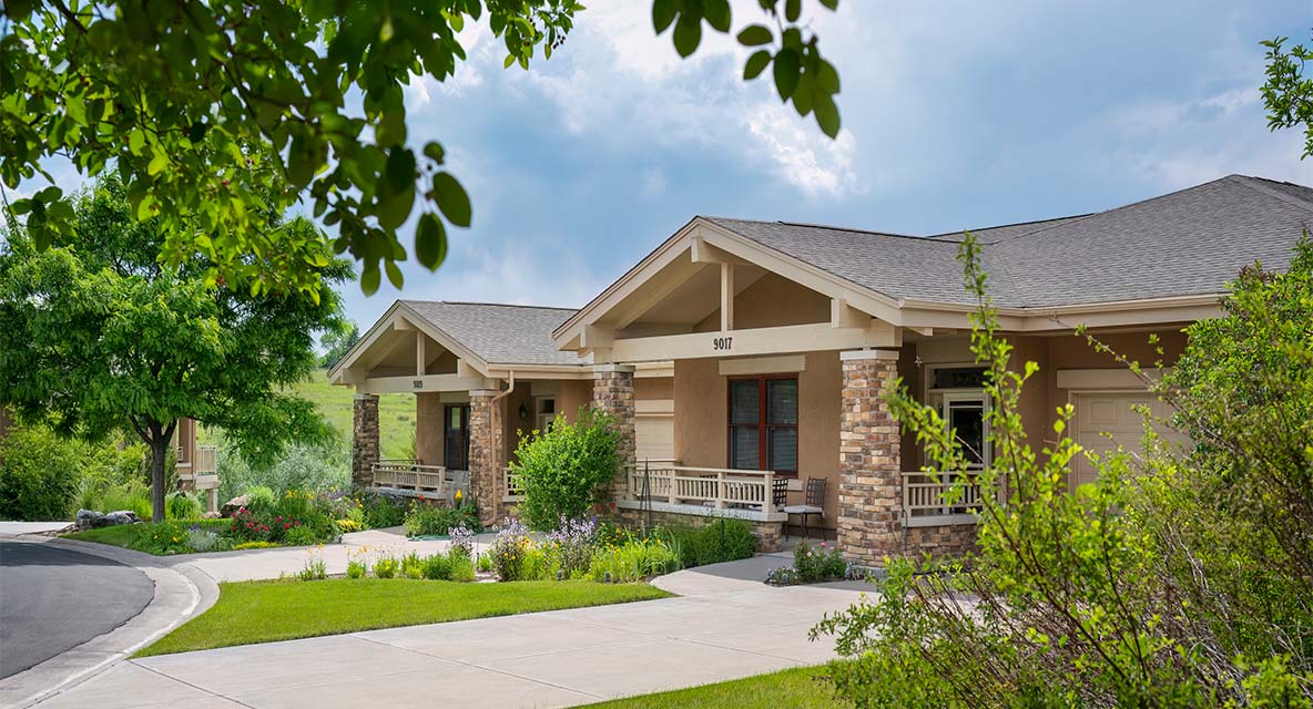 Vi at Highlands Ranch cottage exterior. 