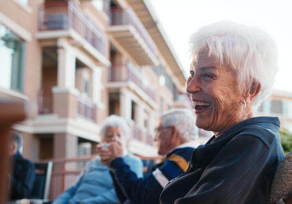 Members of the meditation club laugh together.