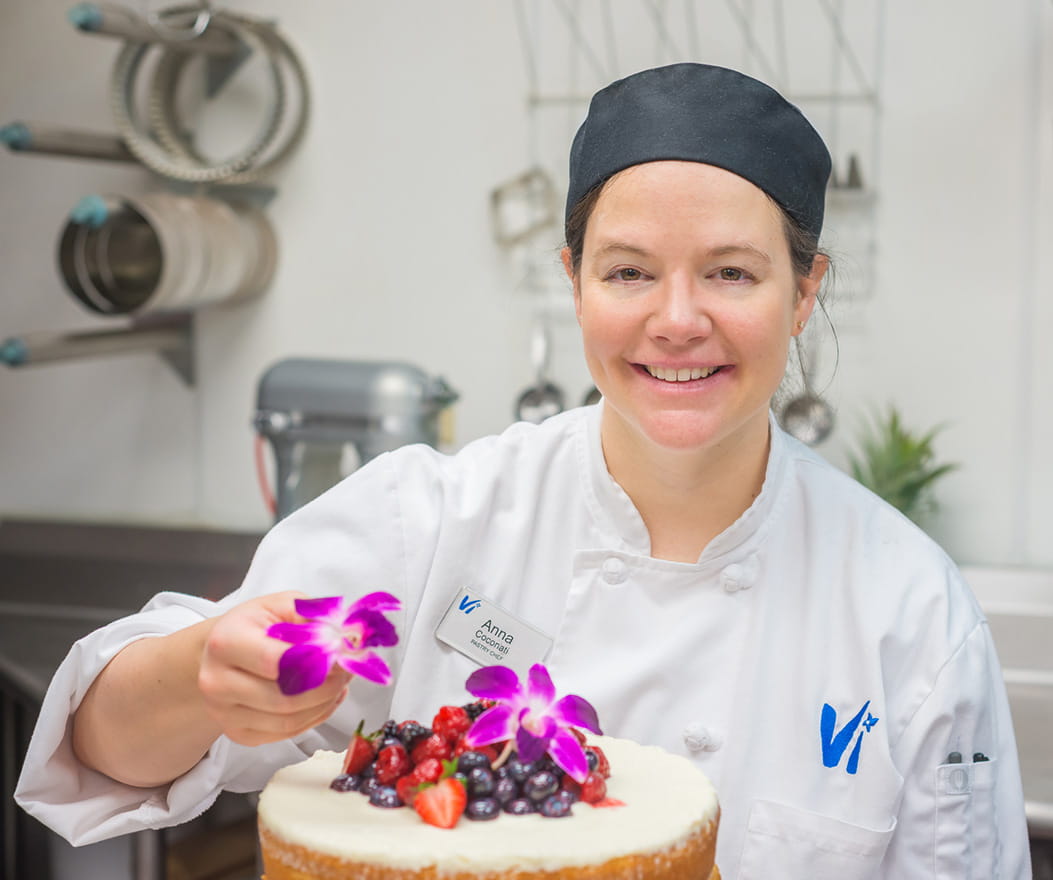 Vi at Highlands Ranch's pastry chef smiles for the camera