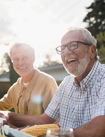 Men laughing outside. 