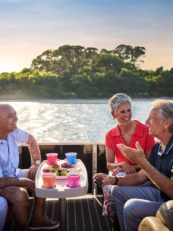 Seniors having fun on a boat. 