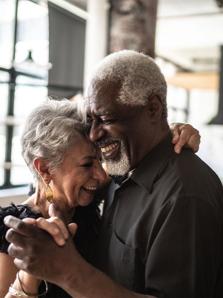 Two seniors dancing together. 