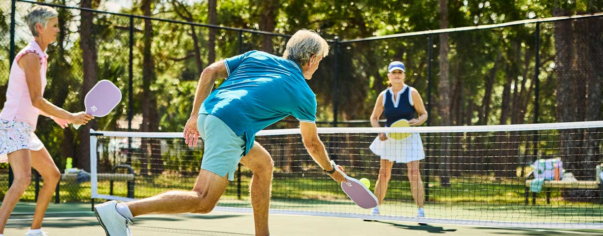 Seniors playing pickleball.