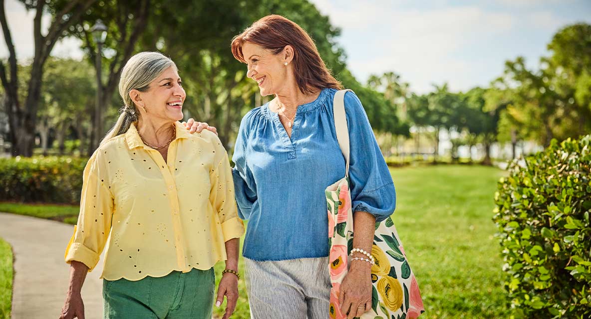Women walking outside at Vi at Lakeside Village. 