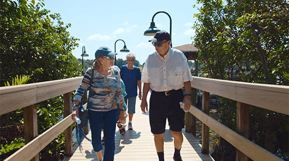 Vi at Lakeside Village residents walking on the dock.