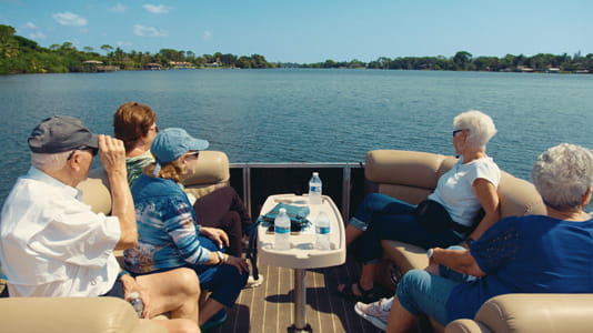 Parks and Rec Club members relax on a boat.