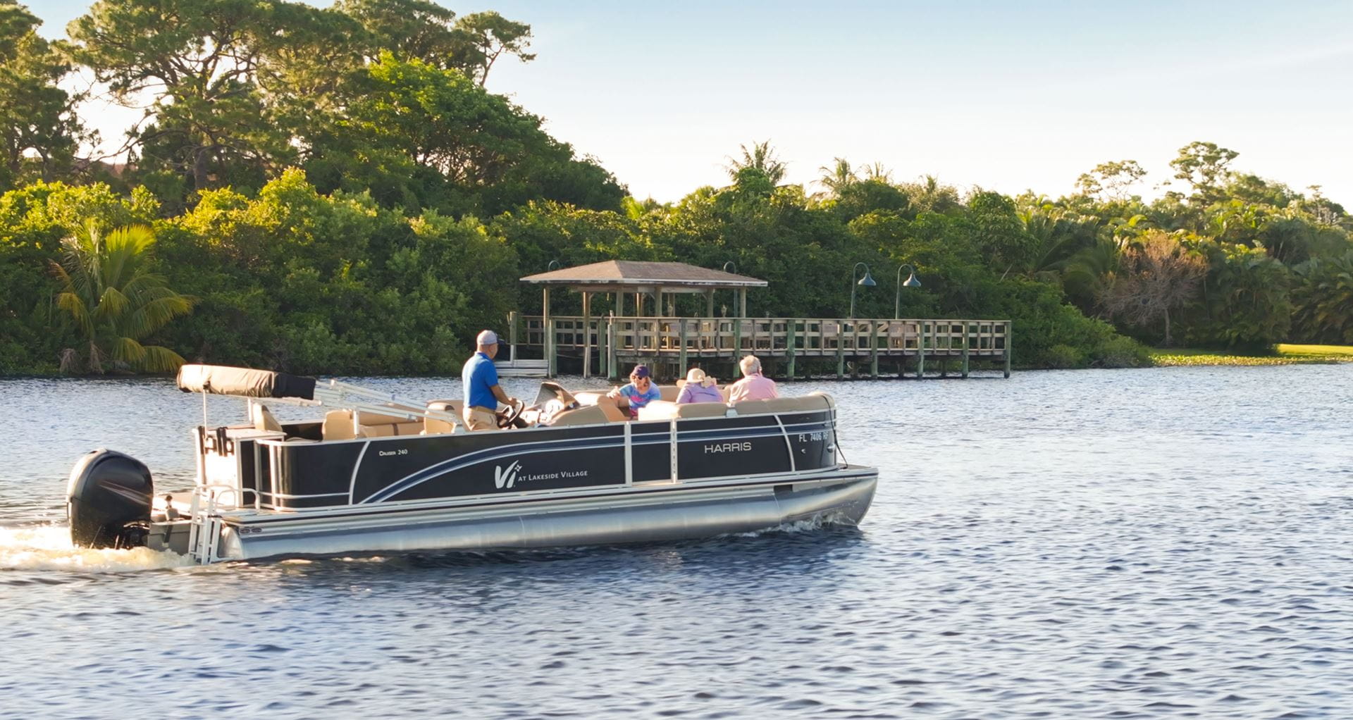 Residents enjoy a sunset cruise on the boat.