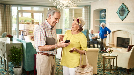 Friends cross paths in the Aventura lobby.