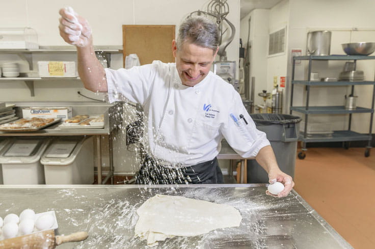 The pastry chef preparing dough.