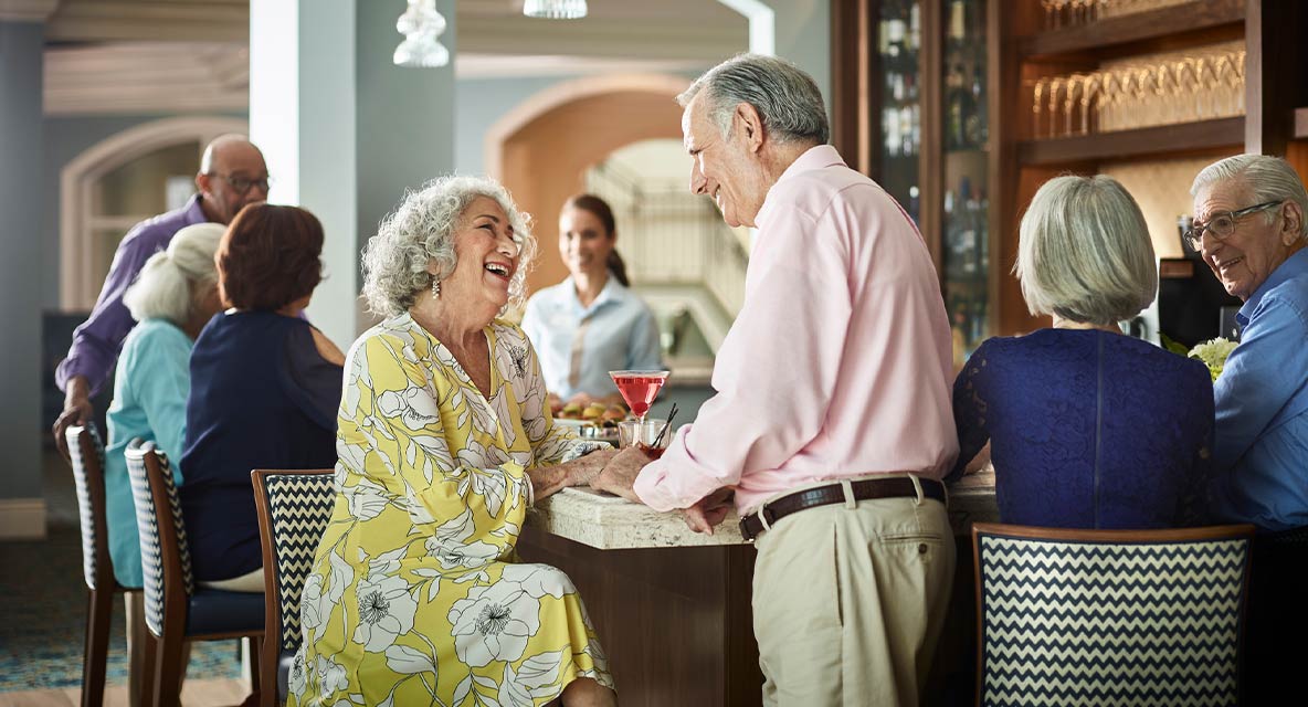 A couple having drink at the bar at Vi at Aventura.