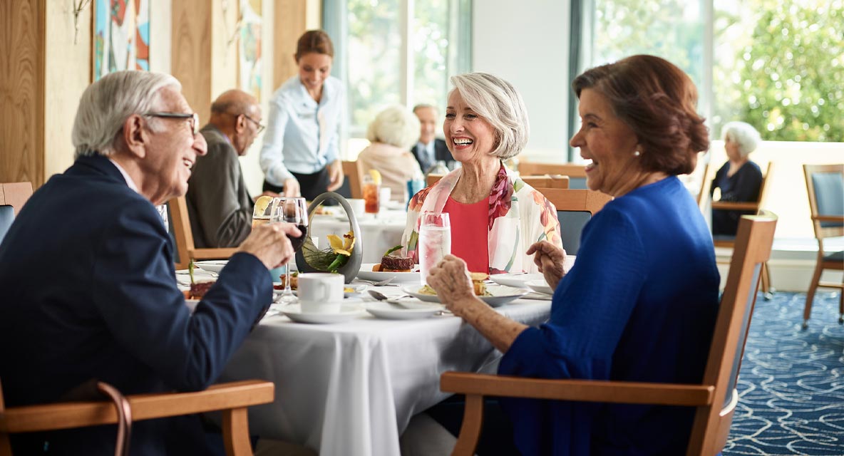 A group of people having dinner at Vi at Aventura.