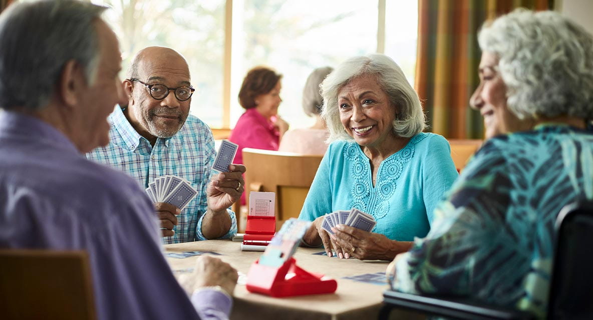 A group of people playing cards.