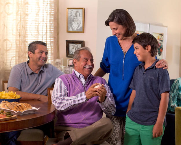 A family spends time together in an apartment.