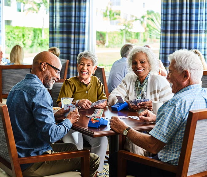 A group of seniors playing cards.