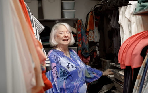 Resident Carol Ures shows off her organized closet.