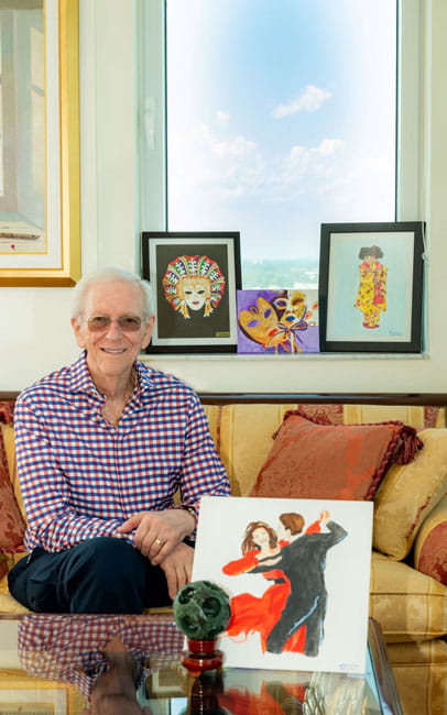 Vi at Aventura resident Hank Solomon sits among his art.