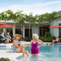 Residents relax by the pool.