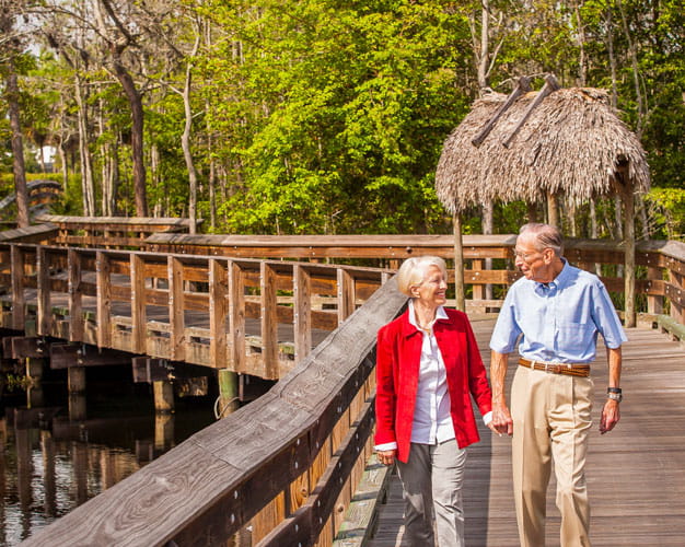 A couple walks along a trail